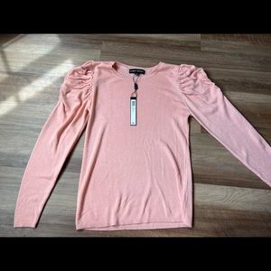 Sweater with ruffled shoulders